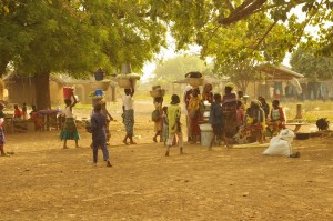Women and children at the Kukuo camp for alleged witches prepare for market day.