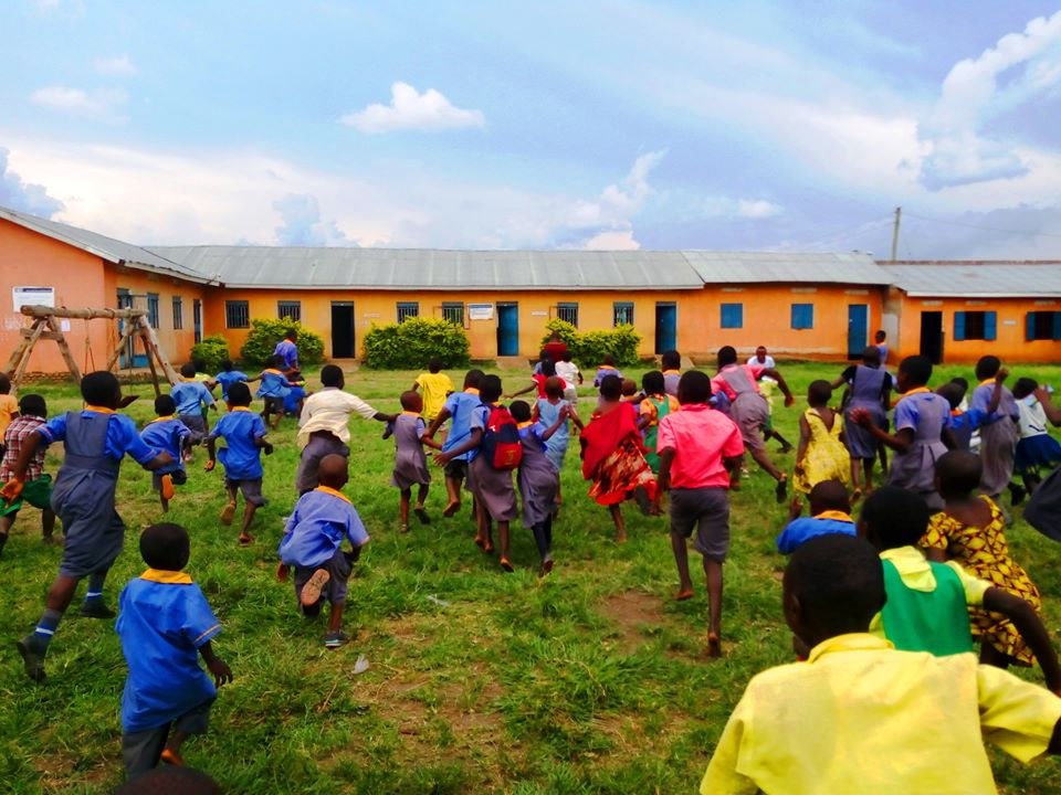 2020-May-Kids running toward Kasese School