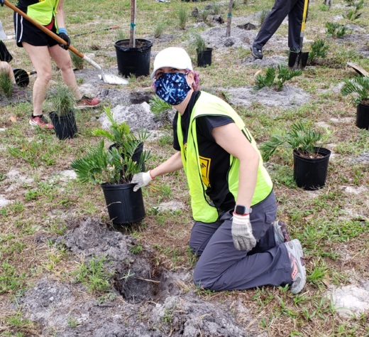 An Atheists of Florida volunteer planting during GreenUp Orlando on Earth Day.
